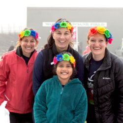 Girls on the run coaches with participant in flower crowns