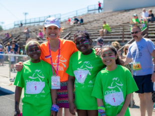Girls on the Run participants with executive director 