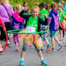 Girls on the Run participant hula hooping