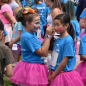 Girls on the Run participant painting team member's face